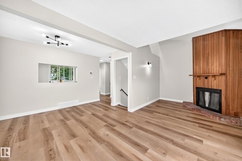 5535 144A Avenue Nw, Edmonton, AB - Indoor Photo Showing Other Room With Fireplace