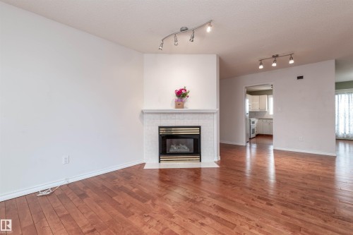 #22 11105 9 Av Nw, Edmonton, AB - Indoor Photo Showing Living Room With Fireplace