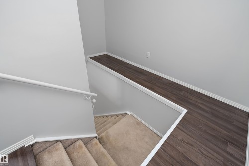 To the upper level from the main floor - #108 10933 82 Av Nw, Edmonton, AB - Indoor Photo Showing Other Room