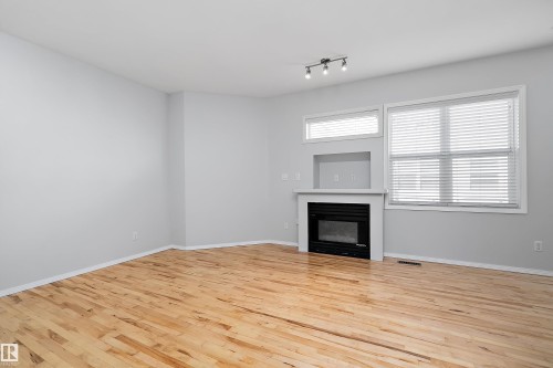 Main Floor - #108 10933 82 Av Nw, Edmonton, AB - Indoor Photo Showing Living Room With Fireplace
