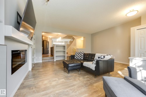 1241 Chappelle Boulevard Sw, Edmonton, AB - Indoor Photo Showing Living Room With Fireplace