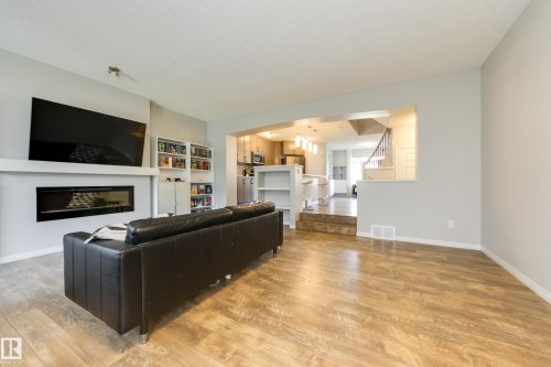 1241 Chappelle Boulevard Sw, Edmonton, AB - Indoor Photo Showing Living Room With Fireplace
