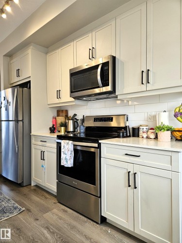 #128 1304 Rutherford Rd Sw Sw, Edmonton, AB - Indoor Photo Showing Kitchen With Stainless Steel Kitchen