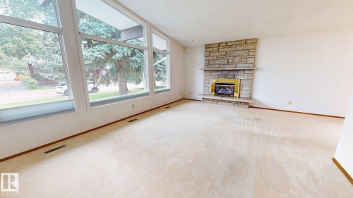 3536 105A Street Nw, Edmonton, AB - Indoor Photo Showing Living Room With Fireplace