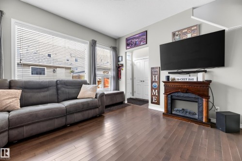 7915 22 Avenue Sw, Edmonton, AB - Indoor Photo Showing Living Room With Fireplace