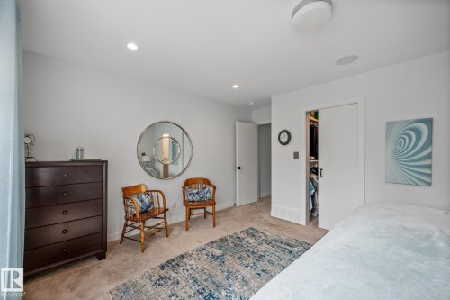 Bedroom featuring plush carpeting, recessed lighting, and a modern ceiling fixture - 14221 101 Avenue Nw, Edmonton, AB - Indoor Photo Showing Bedroom
