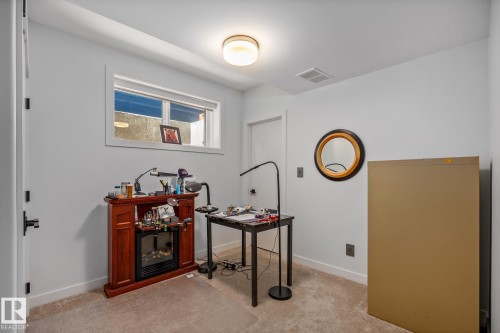 Recessed window providing natural light, overhead flush mount lighting, and light-toned carpeting - 14221 101 Avenue Nw, Edmonton, AB - Indoor
