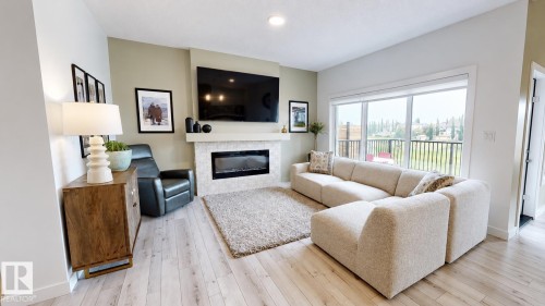 4601 62 Street, Beaumont, AB - Indoor Photo Showing Living Room With Fireplace