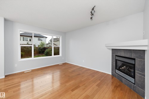 161 Rue Magnan, Beaumont, AB - Indoor Photo Showing Living Room With Fireplace