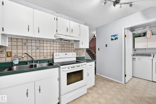 14630 52 Street Nw, Edmonton, AB - Indoor Photo Showing Kitchen With Double Sink