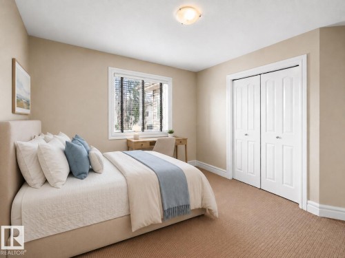 Carpeted room featuring a double bifold door closet with white panels, a single window with blinds, and a ceiling-mounted light fixture - 1338 Rutherford Road Sw, Edmonton, AB - Indoor Photo Showing Bedroom