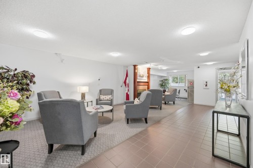 Inviting common area featuring recessed lighting and a neutral color palette - #208 9760 176 St Nw, Edmonton, AB - Indoor