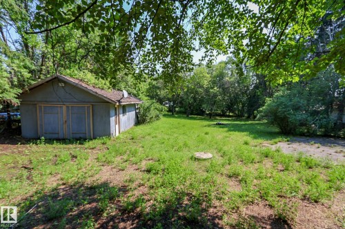 Detached outbuilding with a gabled roof and two wooden access doors - 329 60417 Range Road 124, Rural St. Paul County, AB - Outdoor