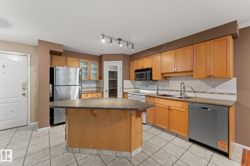 #203 8909 100 St Nw, Edmonton, AB - Indoor Photo Showing Kitchen With Double Sink