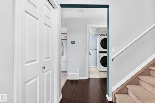 Dark wood-finish flooring with white trim - #72 2505 42 St Nw, Edmonton, AB - Indoor