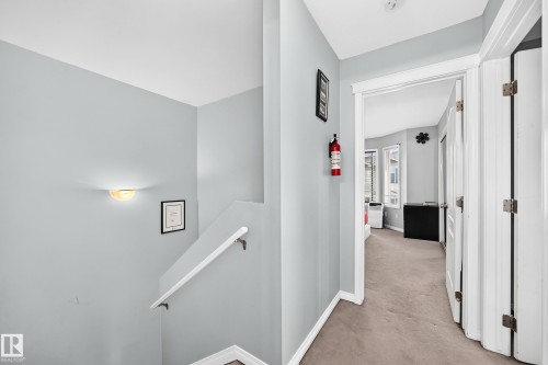 Hallway with light gray walls and white trim - #72 2505 42 St Nw, Edmonton, AB - Indoor Photo Showing Other Room