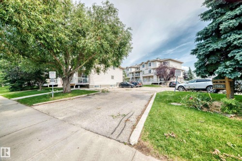 Building exterior with multiple balconies and white railings - #72 2505 42 St Nw, Edmonton, AB - Outdoor