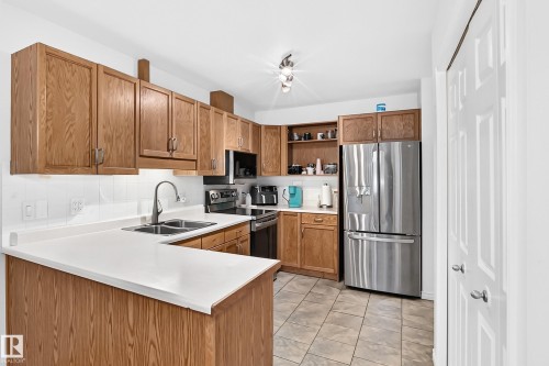 #20 9704 165 St Nw, Edmonton, AB - Indoor Photo Showing Kitchen With Double Sink