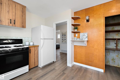You'll appreciate the extra storage space the pantry offers you. - 9747 66 Avenue Nw, Edmonton, AB - Indoor Photo Showing Kitchen