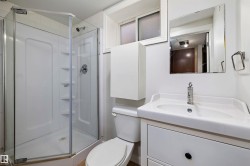 The downstairs bathroom has new subfloor and vinyl plank flooring, and vanity. - 