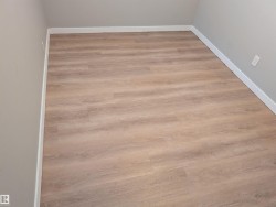 New luxury vinyl plank flooring in 2026. Both basement bedrooms have large hopper style windows allowing for egress in case of emergency. - 