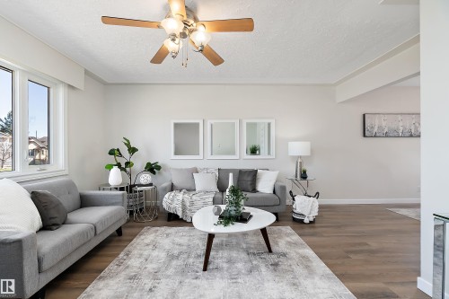 New luxury vinyl plank flooring in 2026. - 9747 66 Avenue Nw, Edmonton, AB - Indoor Photo Showing Living Room