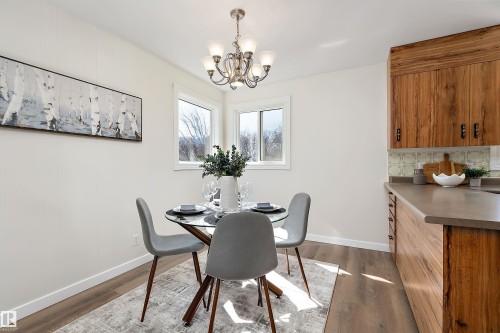 The two windows provide good natural lighting. - 9747 66 Avenue Nw, Edmonton, AB - Indoor Photo Showing Dining Room