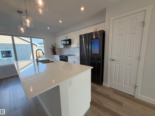 17355 6 Street Ne, Edmonton, AB - Indoor Photo Showing Kitchen With Double Sink