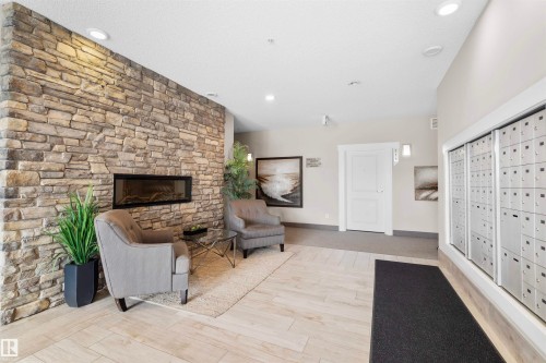 #115 12804 140 Av Nw, Edmonton, AB - Indoor With Fireplace