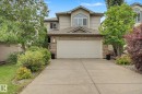 Two-story residence featuring light-colored siding and brick accents - 1047 Leger Boulevard Nw, Edmonton, AB  - Outdoor 