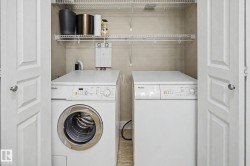 Dedicated laundry closet featuring bi-fold doors, a stacked washer and dryer, and overhead wire shelving - 