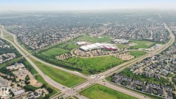 Aerial perspective showcasing extensive residential areas and commercial developments - 