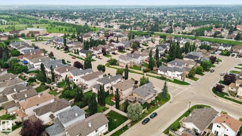 Established residential streetscape featuring detached properties, mature landscaping, and paved roadways - 1047 Leger Boulevard Nw, Edmonton, AB - Outdoor With View