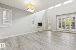 Vaulted ceilings complement the wood-finish flooring - 