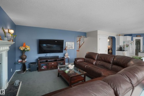 2715 44A Avenue Nw, Edmonton, AB - Indoor Photo Showing Living Room With Fireplace