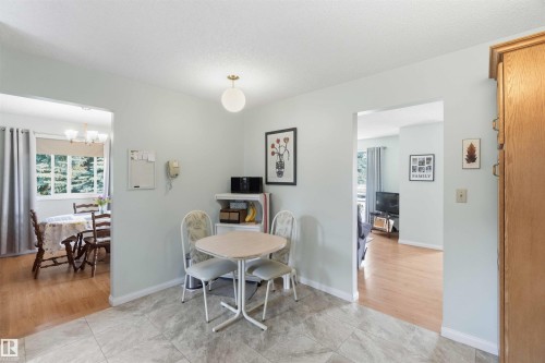 Tiled flooring with a light color palette, recessed lighting, and wood-finish flooring in adjacent spaces - 30 Cavanagh Crescent, Stony Plain, AB - Indoor Photo Showing Dining Room
