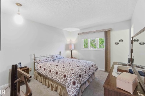 White walls with light-toned carpeting - 30 Cavanagh Crescent, Stony Plain, AB - Indoor Photo Showing Bedroom