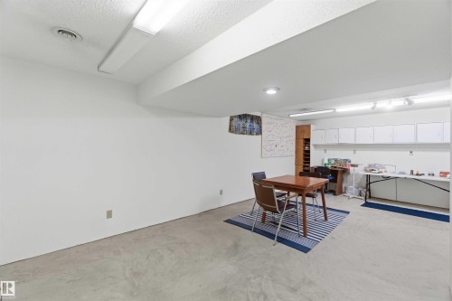 Recessed lighting, track lighting, and fluorescent lighting fixtures illuminate the space - 30 Cavanagh Crescent, Stony Plain, AB - Indoor