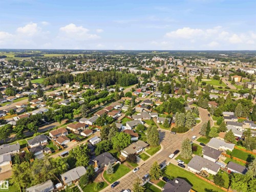 Established neighborhood featuring residential homes, mature trees, and a clear sky backdrop - 30 Cavanagh Crescent, Stony Plain, AB - Outdoor With View