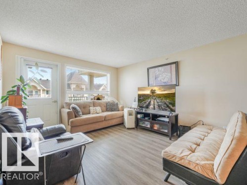 #410 13625 34 St Nw, Edmonton, AB - Indoor Photo Showing Living Room