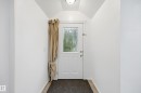 Front entry with a white paneled door featuring decorative glass - 10714 103 Street Nw, Edmonton, AB  - Indoor Photo Showing Other Room 