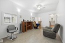 Bright living area featuring light-toned flooring and white walls - 10714 103 Street Nw, Edmonton, AB  - Indoor 