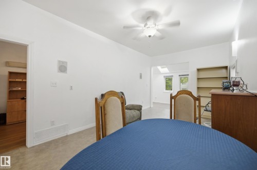 Neutral wall paint, ceiling fan fixture, recessed lighting, and wall-mounted speakers - 10714 103 Street Nw, Edmonton, AB - Indoor