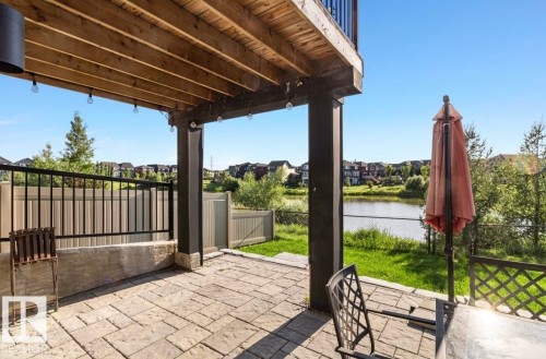 Covered patio with paver flooring and string lighting - 3805 Cherry Loop Sw, Edmonton, AB - Outdoor With Deck Patio Veranda With Exterior