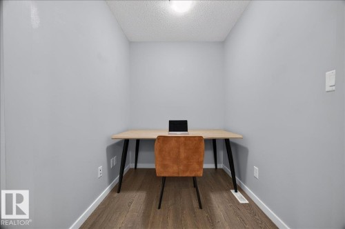 Dedicated alcove featuring light gray walls, wood-finish flooring, and white baseboards - 3043 Keswick Way Sw, Edmonton, AB - Indoor Photo Showing Office