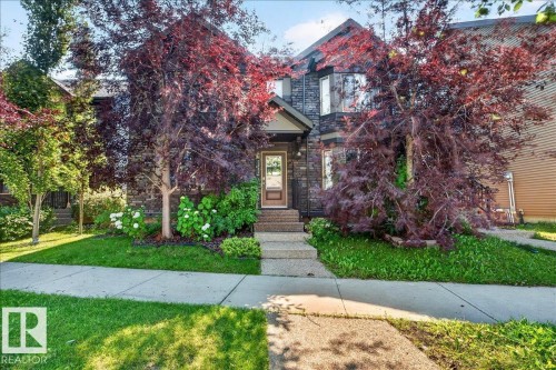 Stone facade residence with a prominent bay window - 3043 Keswick Way Sw, Edmonton, AB - Outdoor