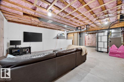 Open basement space featuring exposed wood joists and insulation - 3043 Keswick Way Sw, Edmonton, AB - Indoor Photo Showing Basement