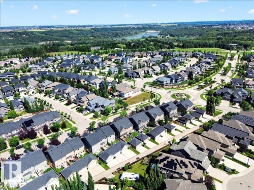 Aerial perspective showcasing a residential community with varied architectural styles - 3043 Keswick Way Sw, Edmonton, AB - Outdoor With View