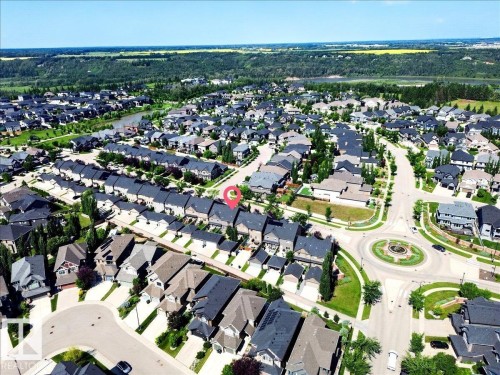 Residential neighborhood featuring a circular street layout and a central roundabout with landscaping - 3043 Keswick Way Sw, Edmonton, AB - Outdoor With View