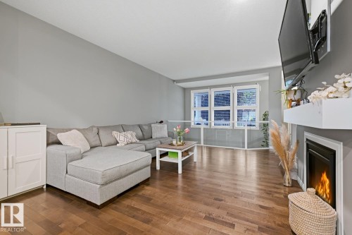 2015 74 Street Sw, Edmonton, AB - Indoor Photo Showing Living Room With Fireplace